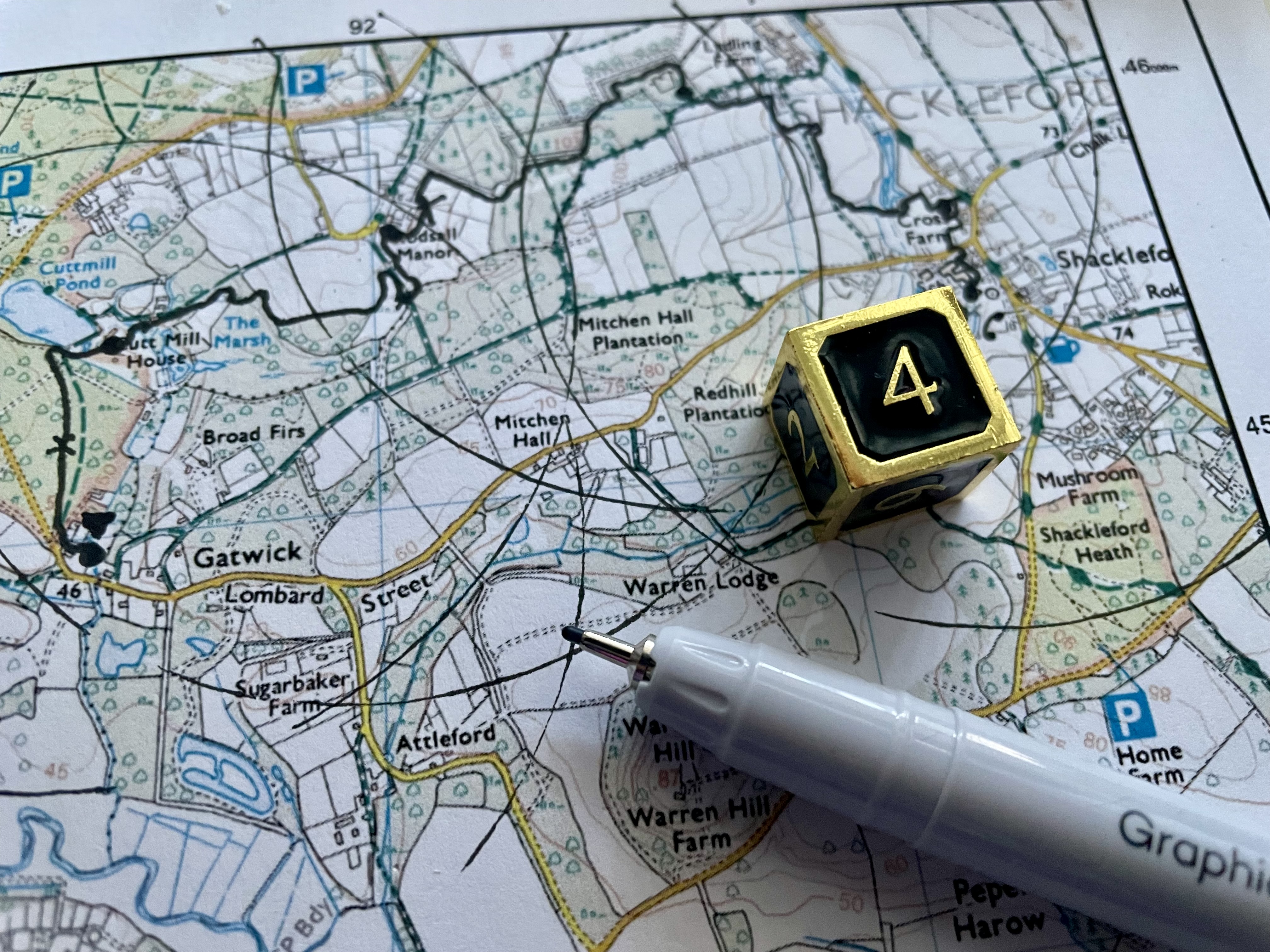 map with a pen and dice